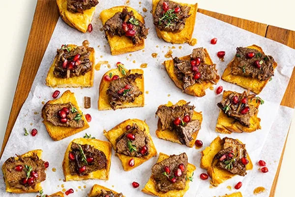 Balsamic Brown Sugar Brisket Bites with Pomegranate and Onion